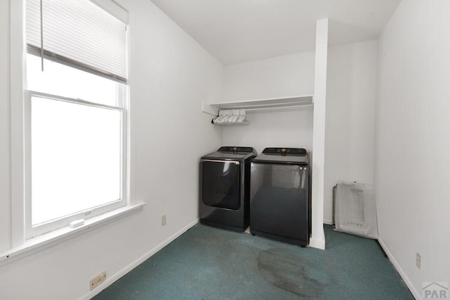 laundry area featuring washing machine and clothes dryer, carpet, and baseboards