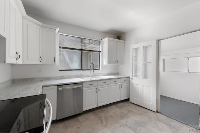 kitchen featuring electric stove, stainless steel dishwasher, light countertops, white cabinets, and a sink