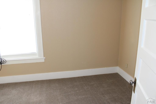 1110-112 E 6th St, Pueblo, CO 81001 - carpeted empty room featuring baseboards