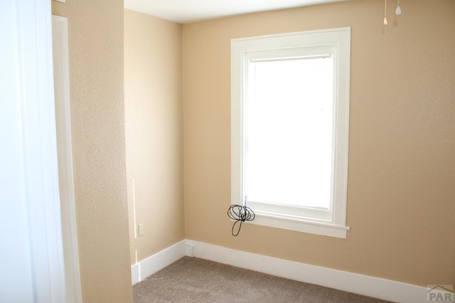 1110-112 E 6th St, Pueblo, CO 81001 - unfurnished room featuring baseboards and carpet floors