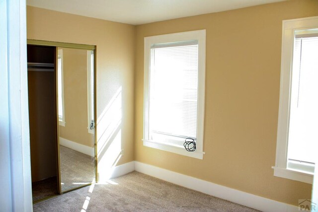 unfurnished room with light carpet and visible vents