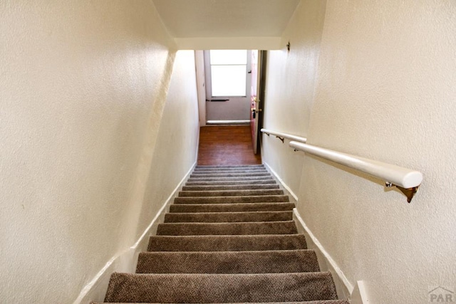 1110-112 E 6th St, Pueblo, CO 81001 - staircase with a textured wall and baseboards