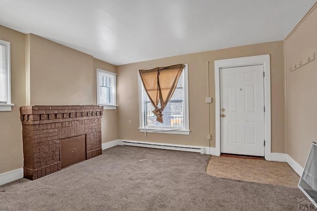 1110-112 E 6th St, Pueblo, CO 81001 - carpeted entryway with a baseboard radiator, baseboards, and a brick fireplace
