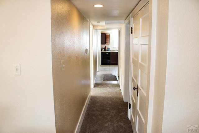 1110-112 E 6th St, Pueblo, CO 81001 - hall featuring dark colored carpet and baseboards
