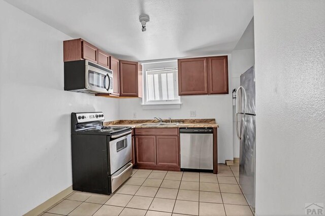 unfurnished bedroom with carpet floors, a closet, and baseboards