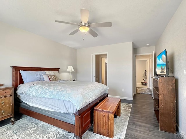 439 N Mitford Dr, Pueblo West, CO 81007 - bedroom featuring dark wood-style flooring, ceiling fan, and baseboards