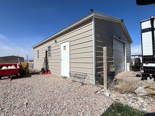 439 N Mitford Dr, Pueblo West, CO 81007 - view of outdoor structure featuring fence and an outbuilding