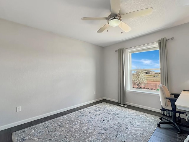 439 N Mitford Dr, Pueblo West, CO 81007 - office space with ceiling fan, baseboards, and dark wood-style floors