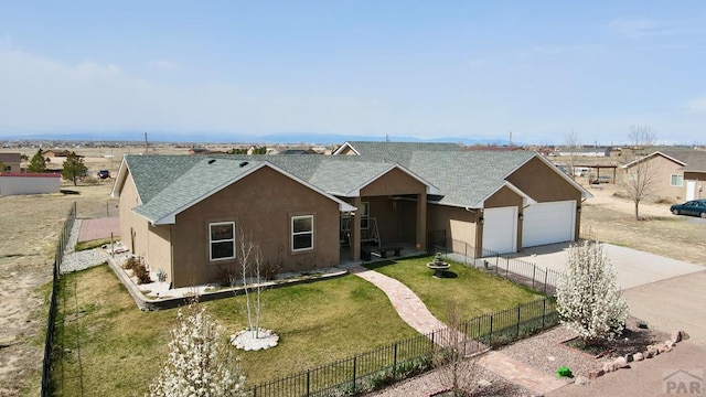 439 N Mitford Dr, Pueblo West, CO 81007 - single story home featuring driveway, a shingled roof, stucco siding, and a garage