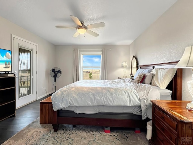 439 N Mitford Dr, Pueblo West, CO 81007 - bedroom with wood finished floors, multiple windows, access to outside, and a ceiling fan