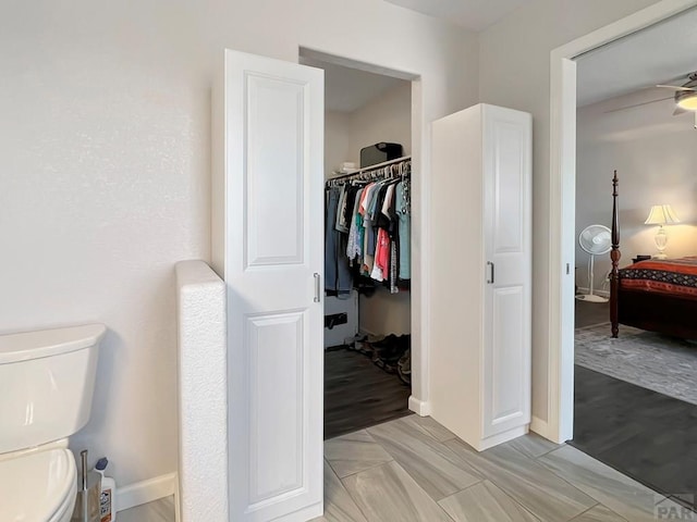 439 N Mitford Dr, Pueblo West, CO 81007 - bathroom featuring ensuite bath, toilet, and baseboards