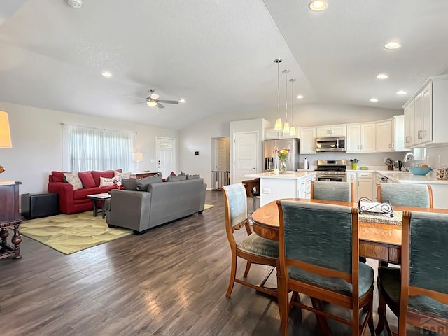 439 N Mitford Dr, Pueblo West, CO 81007 - dining space featuring vaulted ceiling, ceiling fan, dark wood-style floors, and recessed lighting