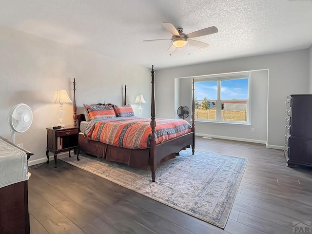 439 N Mitford Dr, Pueblo West, CO 81007 - bedroom with wood finished floors, baseboards, a ceiling fan, and a textured ceiling