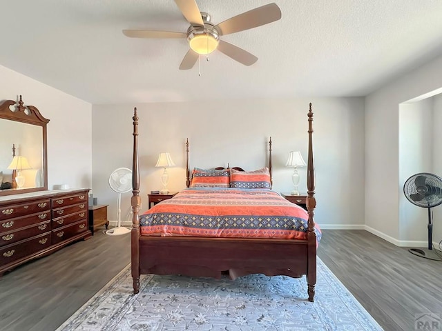 439 N Mitford Dr, Pueblo West, CO 81007 - bedroom featuring wood finished floors, baseboards, and ceiling fan