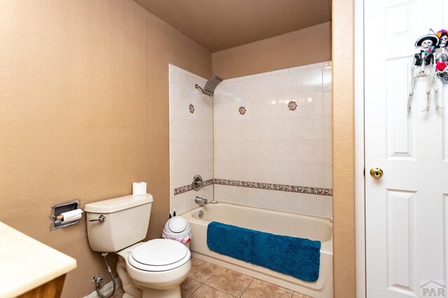 bathroom with tub / shower combination, vanity, toilet, and tile patterned floors