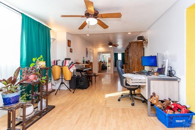 office area with a wealth of natural light, recessed lighting, and wood finished floors