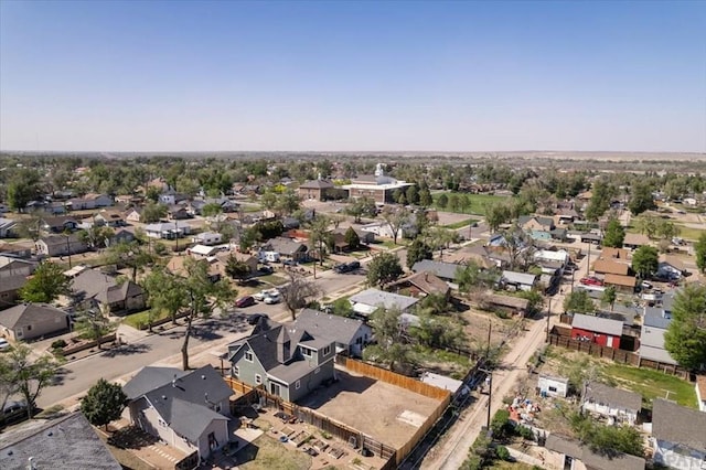 birds eye view of property with a residential view