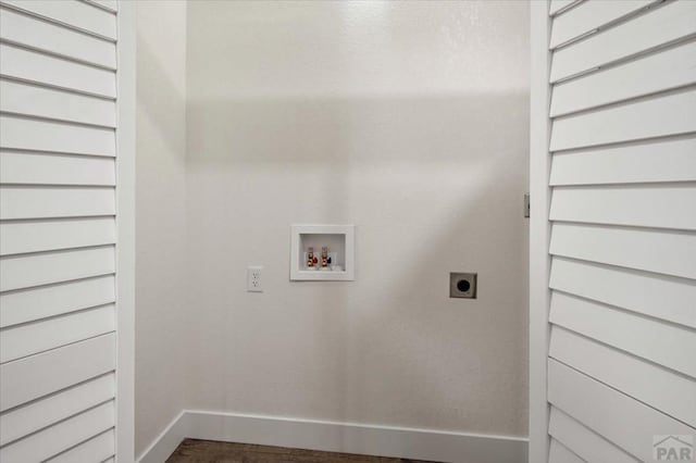 clothes washing area with hookup for a washing machine, baseboards, dark wood-style flooring, and hookup for an electric dryer