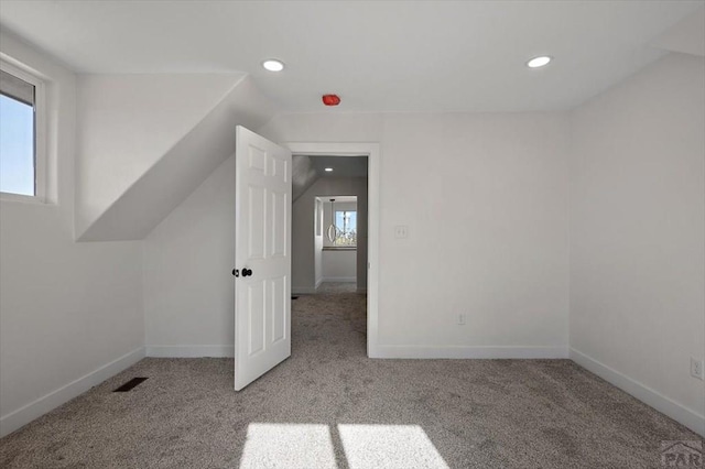 bonus room with recessed lighting, vaulted ceiling, and carpet floors