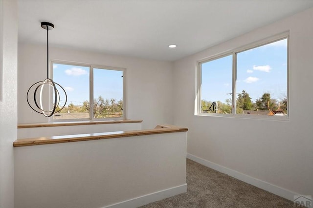 interior space featuring baseboards, carpet floors, and recessed lighting