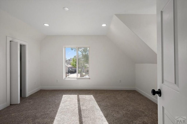 bonus room with recessed lighting, lofted ceiling, carpet flooring, and baseboards