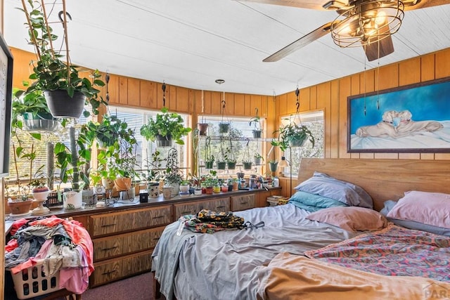 bedroom featuring wood walls