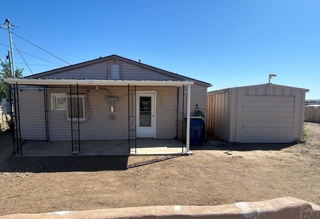 exterior space featuring an outbuilding and a patio area