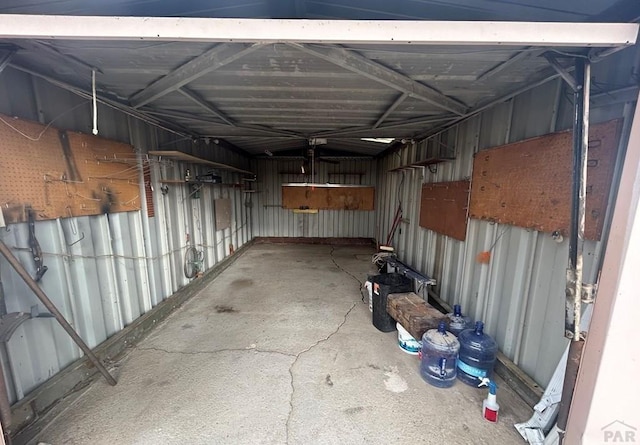 interior space featuring metal wall and a garage