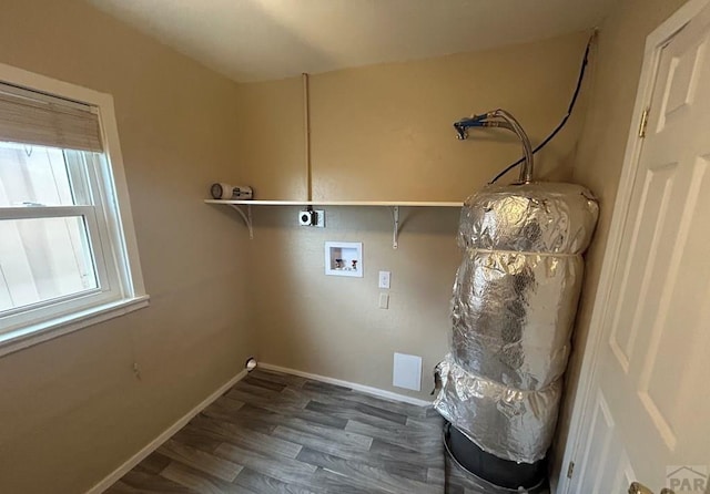 clothes washing area with hookup for a washing machine, wood finished floors, baseboards, hookup for an electric dryer, and laundry area