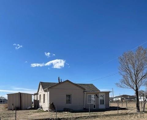 view of side of property with fence