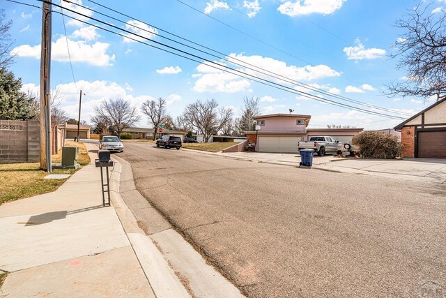 view of road with curbs and sidewalks