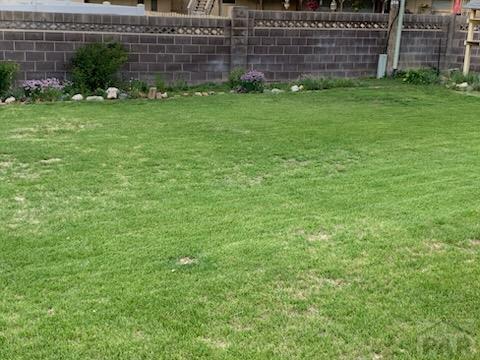 view of yard featuring fence