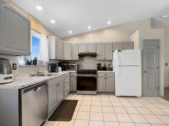 kitchen featuring stainless steel appliances, gray cabinetry, and under cabinet range hood