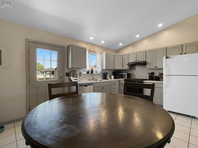 kitchen featuring a sink, appliances with stainless steel finishes, under cabinet range hood, gray cabinets, and light tile patterned flooring