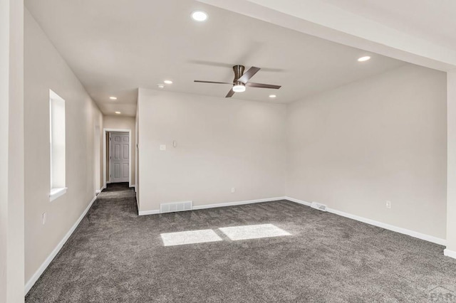 empty room with recessed lighting, visible vents, dark carpet, and baseboards