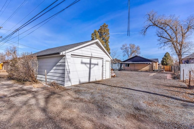 detached garage with fence