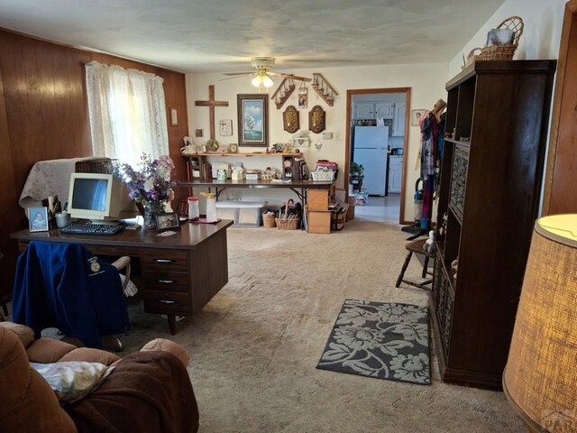 office area with carpet floors and ceiling fan