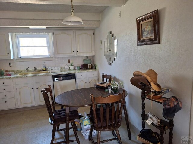 dining space with beam ceiling