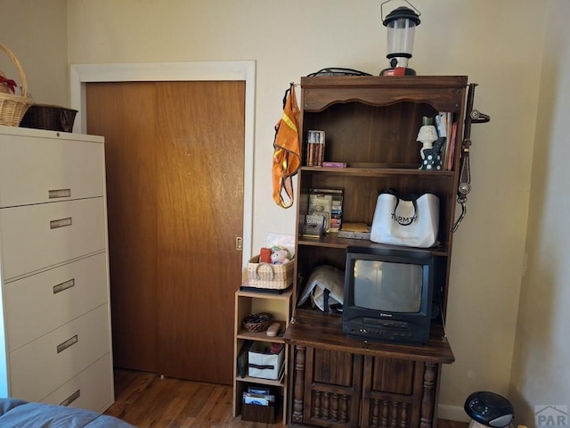 home office with wood finished floors