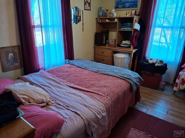 bedroom featuring wood finished floors