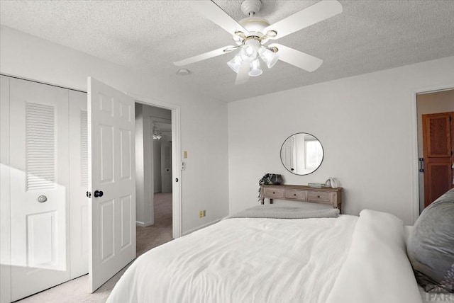 139 Princeton St, Pueblo, CO 81005 - bedroom with light carpet, ceiling fan, a closet, and a textured ceiling