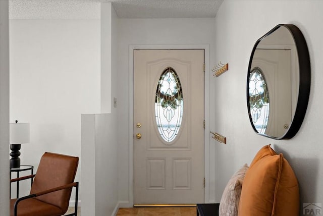 entrance foyer with a textured ceiling