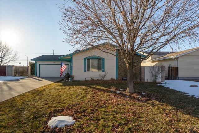 single story home featuring a garage, driveway, fence, and a front yard