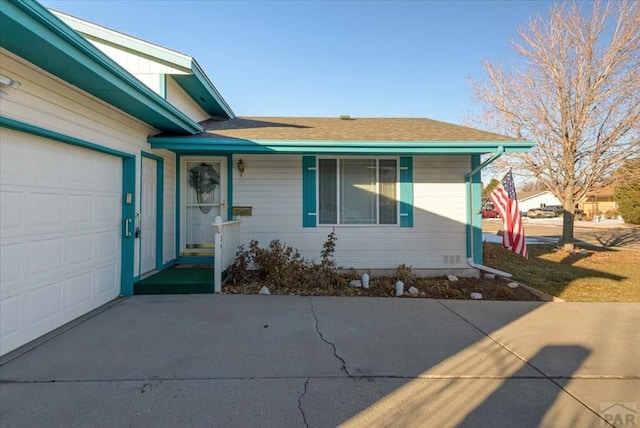 view of front of house featuring a garage and concrete driveway