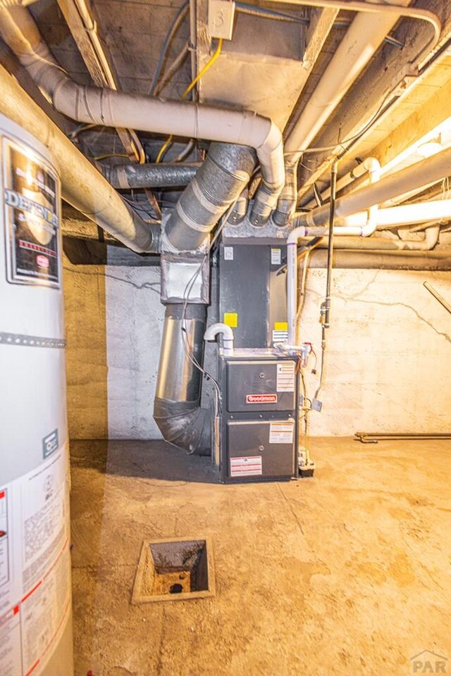 unfinished basement featuring gas water heater