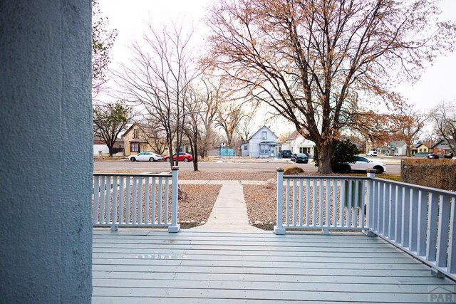 wooden deck with a residential view