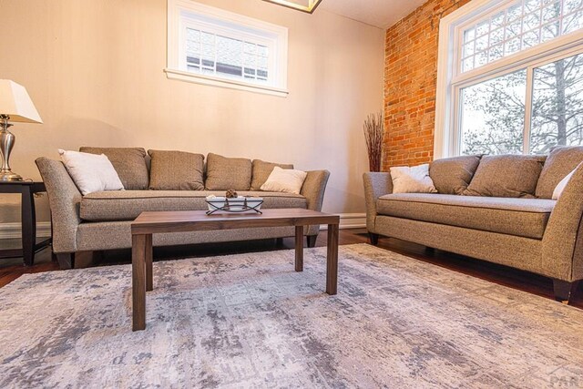 living room featuring wood finished floors and baseboards