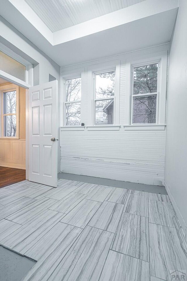 interior space with a tray ceiling