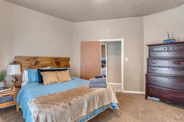 219 E 2nd St, Pueblo, CO 81003 - carpeted bedroom with baseboards
