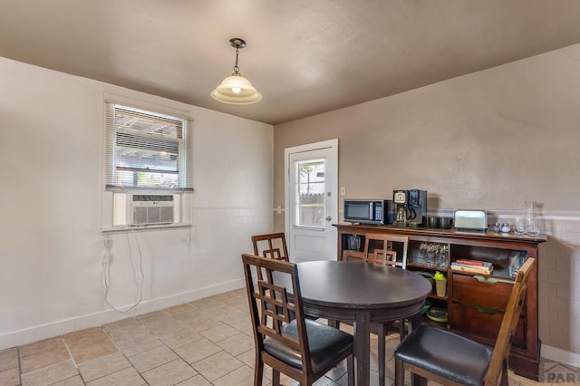 219 E 2nd St, Pueblo, CO 81003 - dining room featuring cooling unit and baseboards